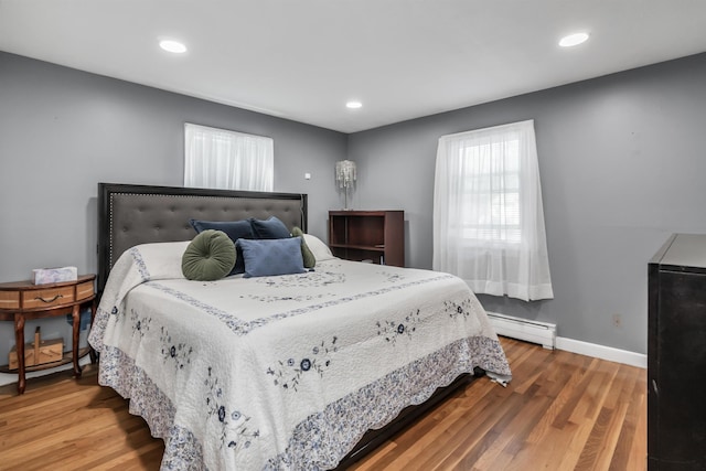 48 Haigh Ave, Salem, NH 03079 - bedroom with a baseboard heating unit, wood finished floors, and recessed lighting