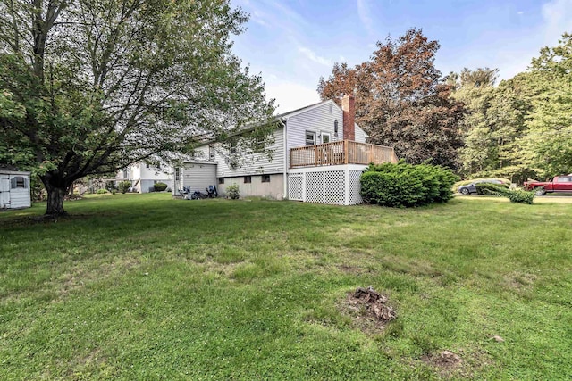 48 Haigh Ave, Salem, NH 03079 - view of green lawn featuring a wooden deck