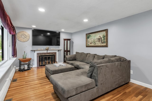 48 Haigh Ave, Salem, NH 03079 - living room featuring light wood-style flooring, a fireplace, and recessed lighting