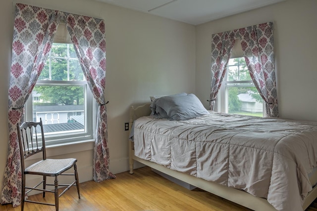 382 Park Ave, Keene, NH 03431 - bedroom with multiple windows and wood finished floors