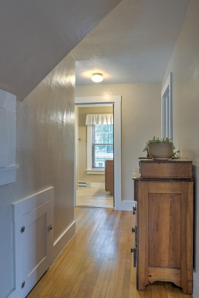 382 Park Ave, Keene, NH 03431 - hallway with light wood-style flooring and a baseboard heating unit