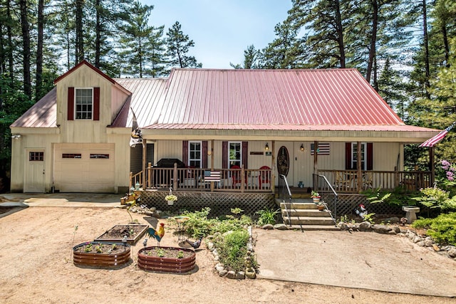 20 Pine Lane Rd, Ossipee, NH 03890 - view of front of property with a porch, a metal roof, dirt driveway, and a garage