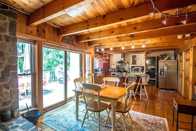 20 Pine Lane Rd, Ossipee, NH 03890 - dining room with rail lighting, wood-type flooring, and a wood ceiling with exposed beams