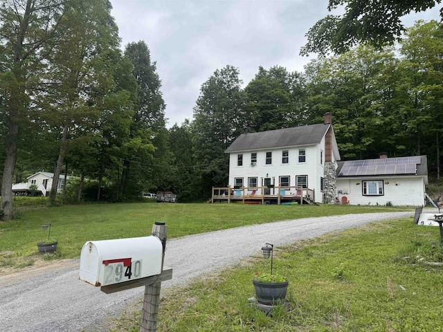 2940 Rte 30, Castleton, VT 05732 - view of front of home with a chimney, a front yard, and a deck