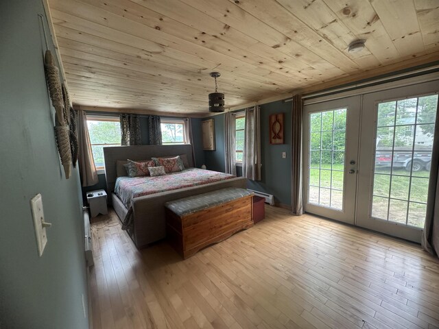 2940 Rte 30, Castleton, VT 05732 - bedroom with wood ceiling, a baseboard heating unit, access to outside, french doors, and light wood-style floors