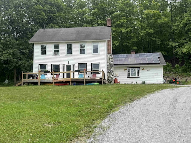 2940 Rte 30, Castleton, VT 05732 - view of front of house featuring a chimney, a front yard, and a deck