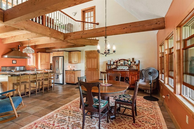 532 Randolph Rd, Stowe, VT 05672 - dining room featuring a chandelier, beam ceiling, and high vaulted ceiling