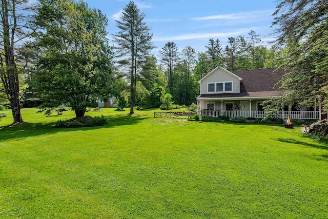 532 Randolph Rd, Stowe, VT 05672 - view of green lawn with a porch