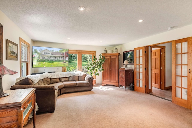 532 Randolph Rd, Stowe, VT 05672 - living area featuring french doors, light colored carpet, a textured ceiling, and recessed lighting