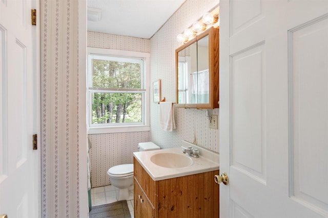 532 Randolph Rd, Stowe, VT 05672 - full bathroom with wallpapered walls, vanity, tile patterned floors, and a shower with shower curtain