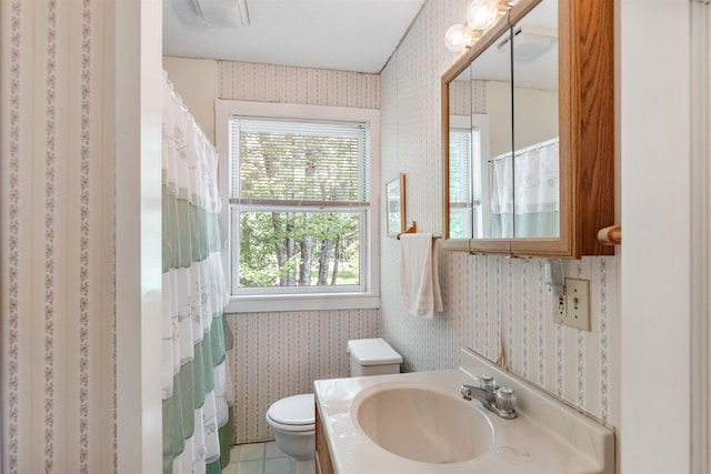 532 Randolph Rd, Stowe, VT 05672 - full bath with wallpapered walls, healthy amount of natural light, vanity, and a shower with curtain