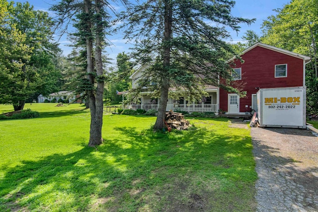 532 Randolph Rd, Stowe, VT 05672 - view of front of house featuring covered porch and a front lawn
