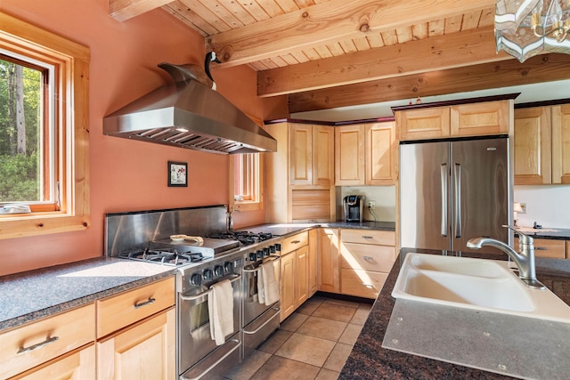 532 Randolph Rd, Stowe, VT 05672 - kitchen with stainless steel appliances, light brown cabinetry, range hood, tile patterned floors, and a wooden ceiling with exposed beams