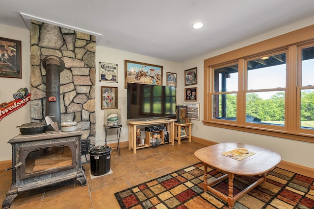 3 Simon Hill Rd, Ossipee, NH 03864 - living room featuring a wood stove, recessed lighting, and stone finish floors