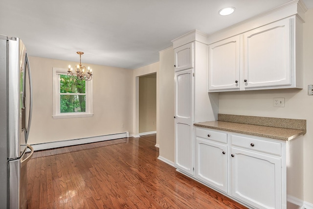 2 Littlehale Rd, Durham, NH 03824 - kitchen featuring freestanding refrigerator, white cabinets, a chandelier, a baseboard radiator, and dark wood-type flooring