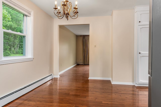 2 Littlehale Rd, Durham, NH 03824 - unfurnished room with a baseboard heating unit, a chandelier, wood finished floors, and a baseboard radiator
