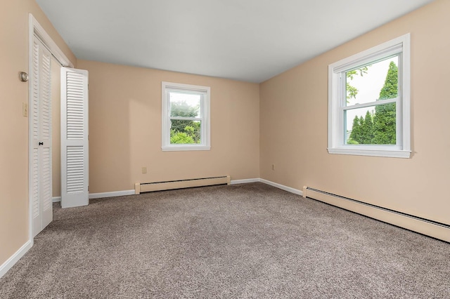 2 Littlehale Rd, Durham, NH 03824 - unfurnished bedroom featuring a baseboard heating unit and carpet floors