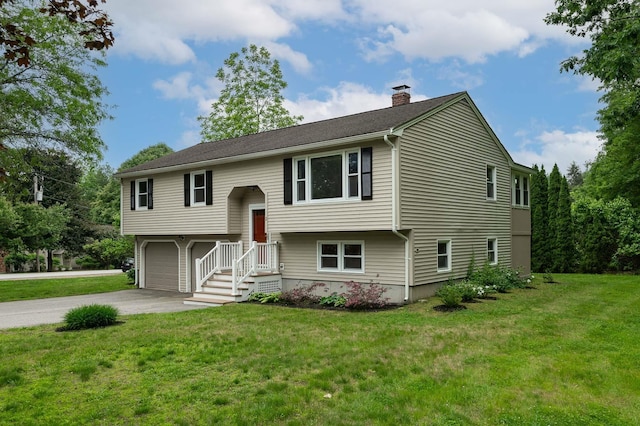2 Littlehale Rd, Durham, NH 03824 - bi-level home with a chimney, driveway, and a front lawn