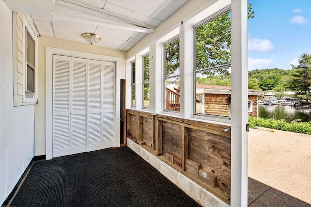 23 Riverlake St, Alton, NH 03810 - unfurnished sunroom featuring a drop ceiling and a water view