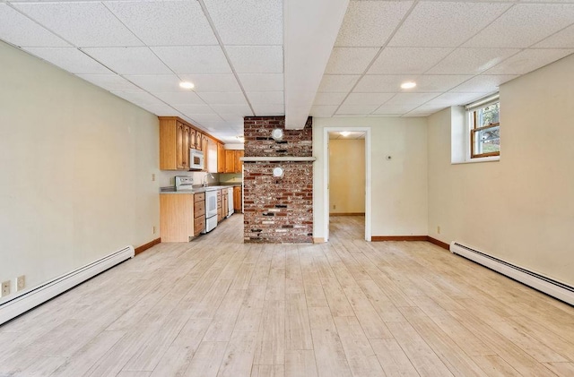 23 Riverlake St, Alton, NH 03810 - unfurnished living room featuring a baseboard radiator, a drop ceiling, and light wood finished floors
