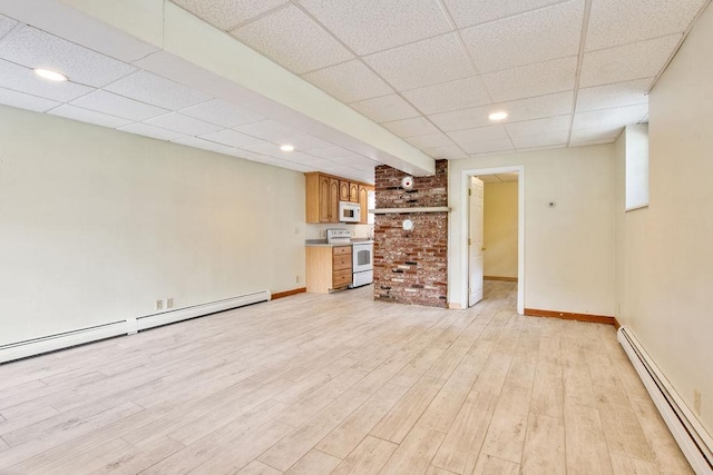 23 Riverlake St, Alton, NH 03810 - unfurnished living room with a baseboard radiator, a drop ceiling, light wood-style floors, and recessed lighting