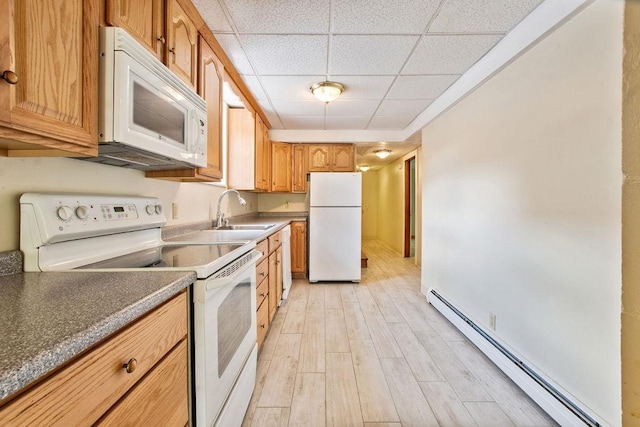 23 Riverlake St, Alton, NH 03810 - kitchen with white appliances, baseboard heating, light wood-style flooring, a paneled ceiling, and dark countertops
