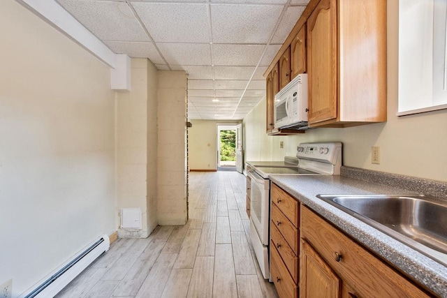 23 Riverlake St, Alton, NH 03810 - kitchen featuring white appliances, baseboard heating, a drop ceiling, light wood-style floors, and brown cabinetry