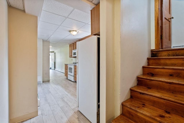 23 Riverlake St, Alton, NH 03810 - staircase featuring a paneled ceiling and wood finished floors