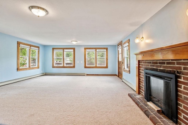 23 Riverlake St, Alton, NH 03810 - unfurnished living room with a brick fireplace, carpet flooring, and a baseboard radiator