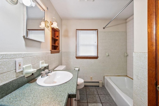 23 Riverlake St, Alton, NH 03810 - full bathroom featuring baseboard heating, tile walls, tile patterned floors, vanity, and shower / tub combination