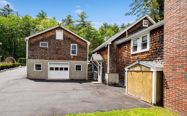23 Riverlake St, Alton, NH 03810 - view of side of home featuring driveway