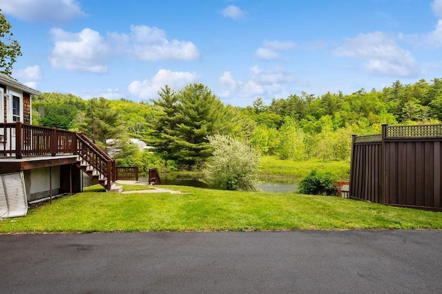 23 Riverlake St, Alton, NH 03810 - view of yard with stairs, a forest view, and a deck