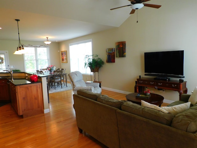 150 Pleasant Pond Way Unit 15, Manchester, NH 03102 - living room with a ceiling fan and light wood-style floors