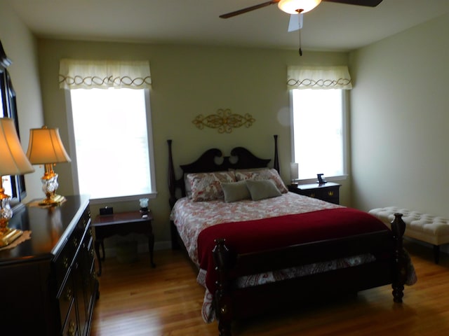 150 Pleasant Pond Way Unit 15, Manchester, NH 03102 - bedroom with multiple windows, light wood finished floors, and a ceiling fan
