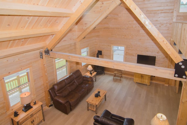 535 Mead Hill Rd, Holland, VT 05830 - living room with wood walls, wood finished floors, healthy amount of natural light, and wooden ceiling