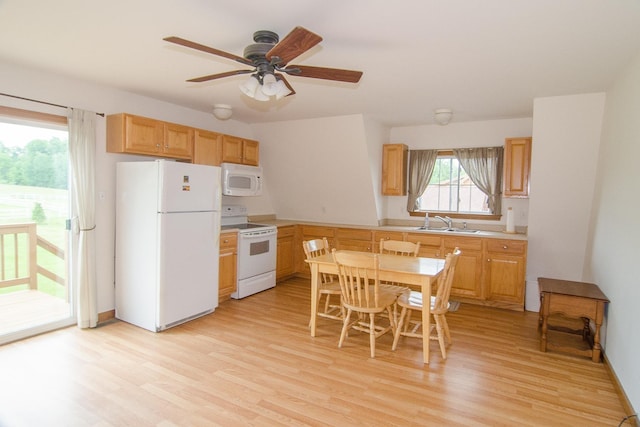535 Mead Hill Rd, Holland, VT 05830 - kitchen with white appliances, light wood finished floors, a ceiling fan, and light countertops