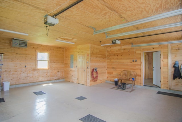 535 Mead Hill Rd, Holland, VT 05830 - garage with a garage door opener and wood walls