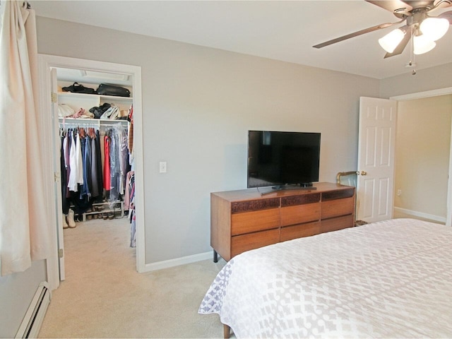 343 Cobblestone Cir S, Burlington, VT 05403 - bedroom featuring a baseboard heating unit, light carpet, a spacious closet, a closet, and ceiling fan