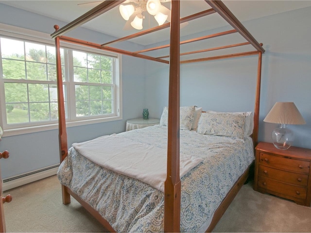 343 Cobblestone Cir S, Burlington, VT 05403 - carpeted bedroom featuring a baseboard heating unit and ceiling fan