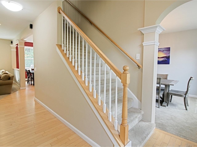 343 Cobblestone Cir S, Burlington, VT 05403 - stairs with ornate columns, arched walkways, and hardwood / wood-style floors