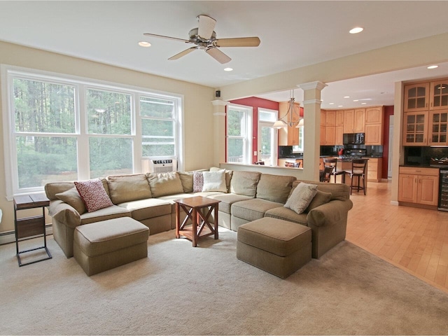 343 Cobblestone Cir S, Burlington, VT 05403 - living room with recessed lighting, beverage cooler, decorative columns, ceiling fan, and cooling unit