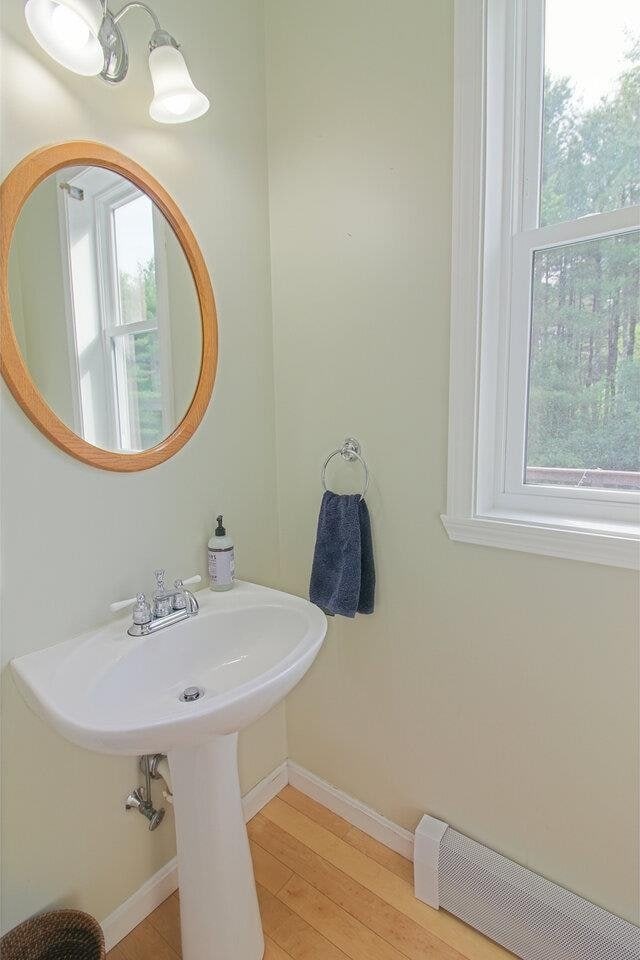 343 Cobblestone Cir S, Burlington, VT 05403 - bathroom with baseboards and wood finished floors