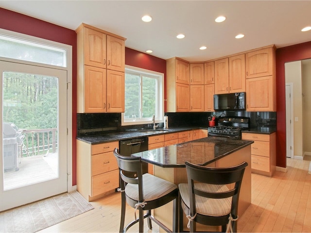 343 Cobblestone Cir S, Burlington, VT 05403 - kitchen featuring gas range, black microwave, backsplash, light wood finished floors, and recessed lighting