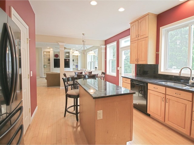 343 Cobblestone Cir S, Burlington, VT 05403 - kitchen featuring freestanding refrigerator, black dishwasher, light brown cabinets, a kitchen island, and light wood-type flooring