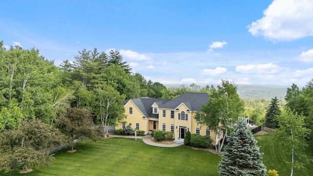 3 Baldwin Ln, Bedford, NH 03110 - view of front facade with a front lawn and a wooded view