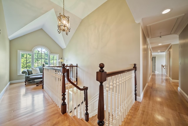 3 Baldwin Ln, Bedford, NH 03110 - hallway with an upstairs landing, attic access, light wood-style floors, and vaulted ceiling