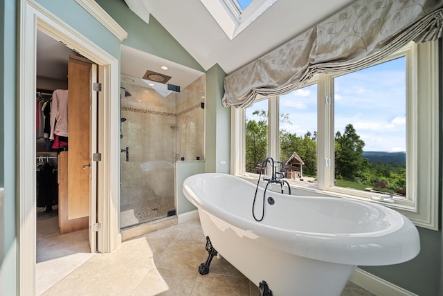 3 Baldwin Ln, Bedford, NH 03110 - bathroom featuring a freestanding tub, a stall shower, lofted ceiling, a spacious closet, and a skylight