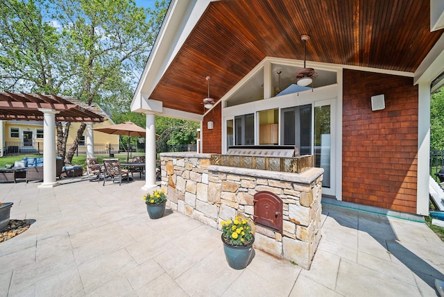 3 Baldwin Ln, Bedford, NH 03110 - view of patio featuring exterior bar, a pergola, and an outdoor kitchen