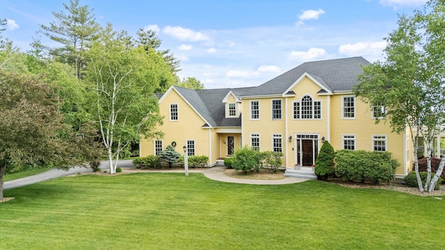 3 Baldwin Ln, Bedford, NH 03110 - colonial home featuring a front lawn and roof with shingles
