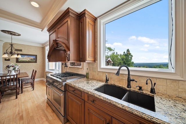 3 Baldwin Ln, Bedford, NH 03110 - kitchen with double oven range, brown cabinets, tasteful backsplash, light wood-style floors, and ornamental molding